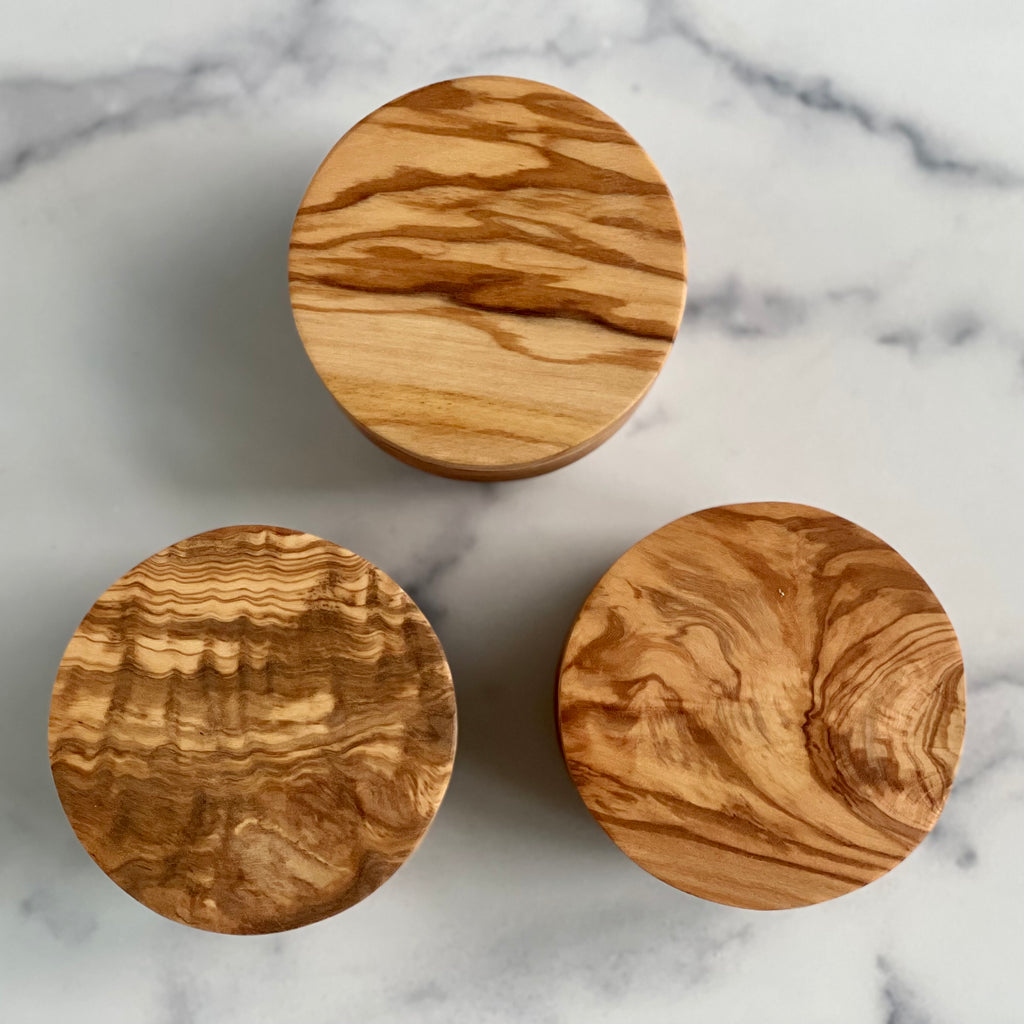 These three salt cellar tops show the diversity of olivewood grain.