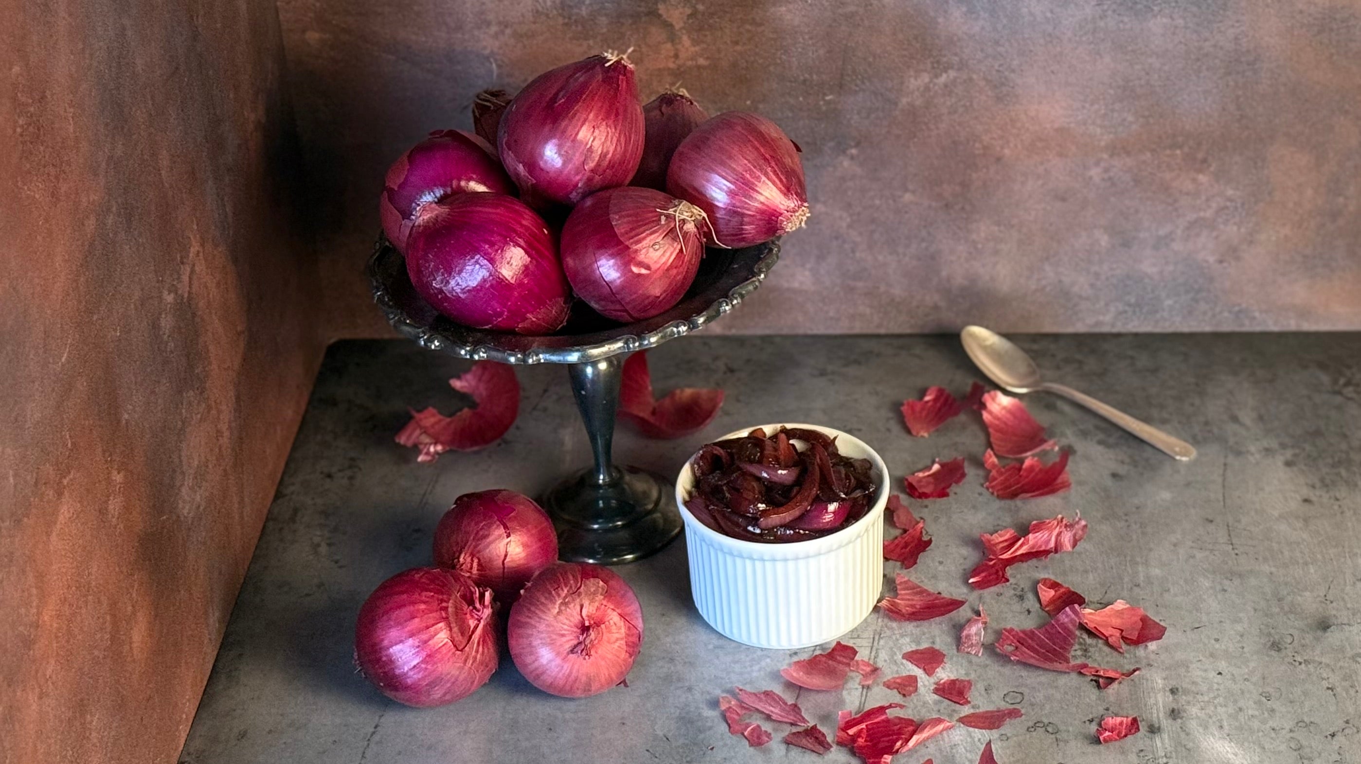 3 lbs of red onions shown on a pedestal, on a counter, and made into a relish