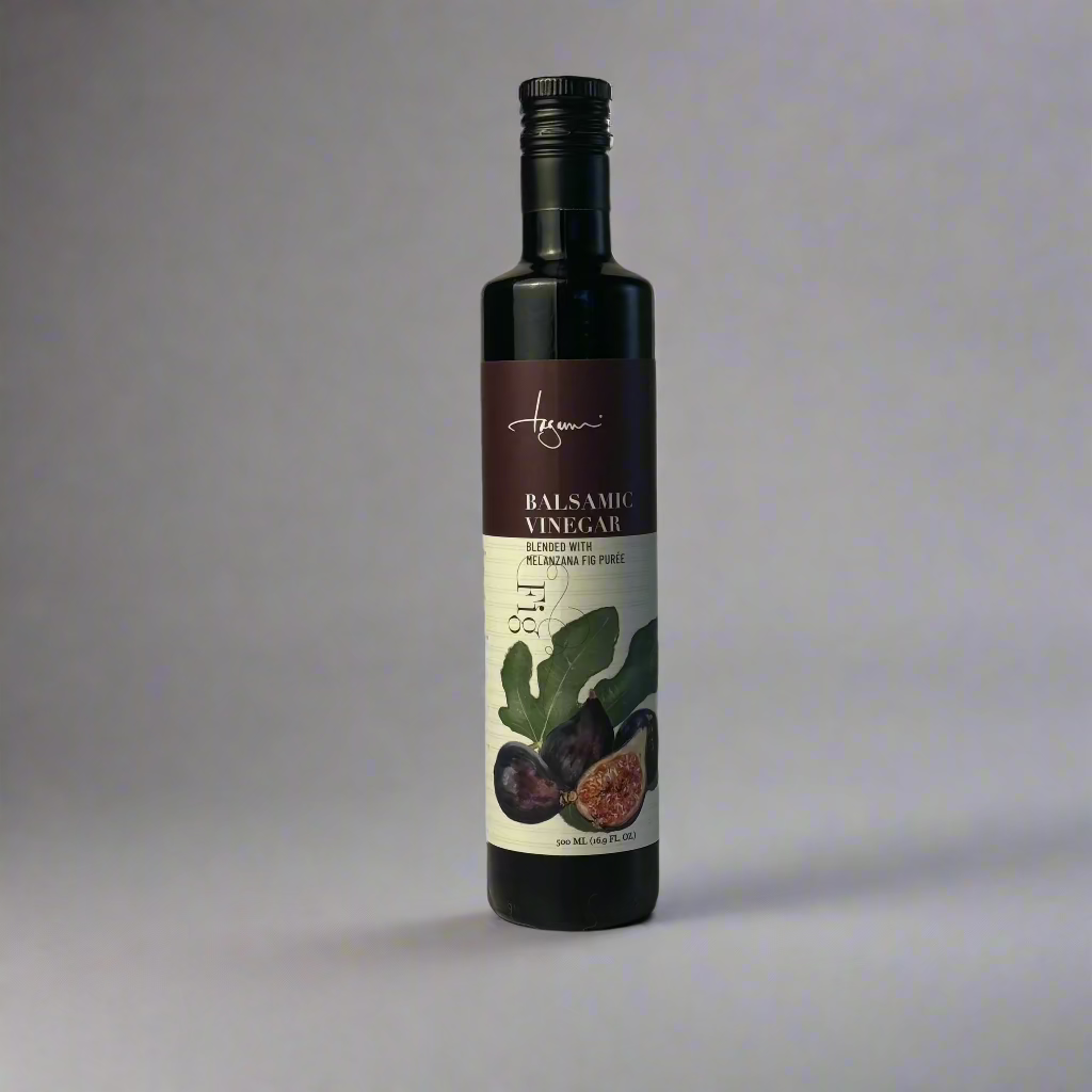 A single bottle of Fig Balsamic Vinegar in shown on a plain background