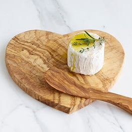Heart Shaped Olivewood Board with Cheese, Olive Oil, and a sprig of fresh herbs