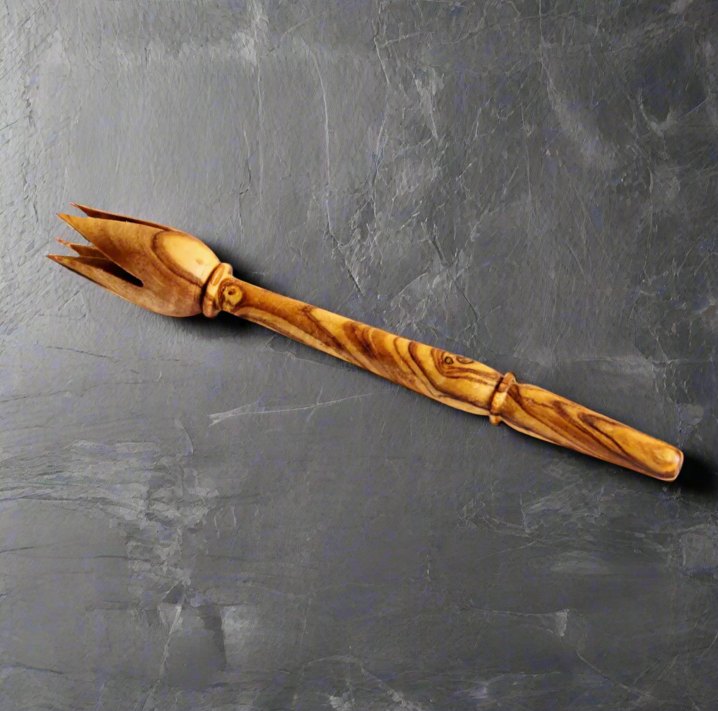 This traditional tool is used to pick up olives with a tulip shaped end comprised of four curved and pointed "petals".