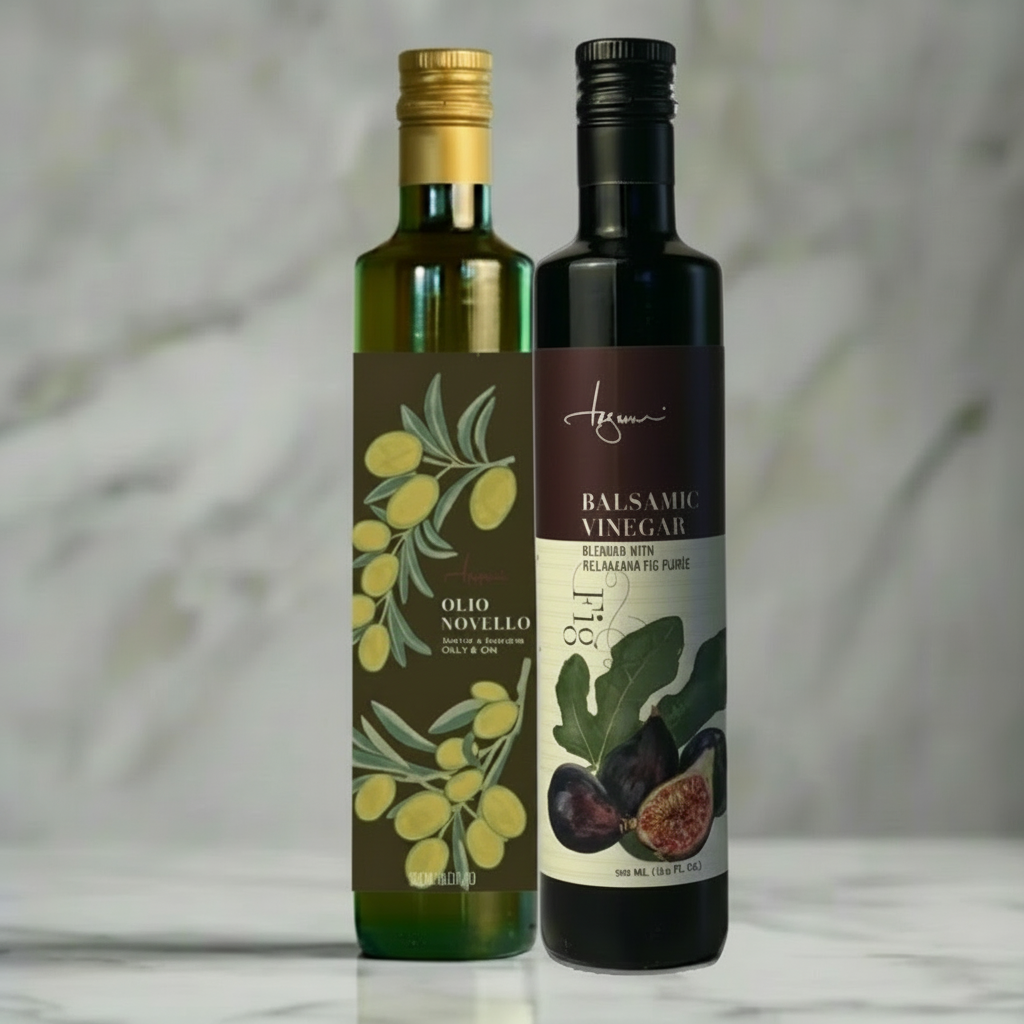 A pair of 500 ml oil bottles show mock up of the Lucero Olio Novello and Tagami Fig Balsamic Vinegar in a marble kitchen.