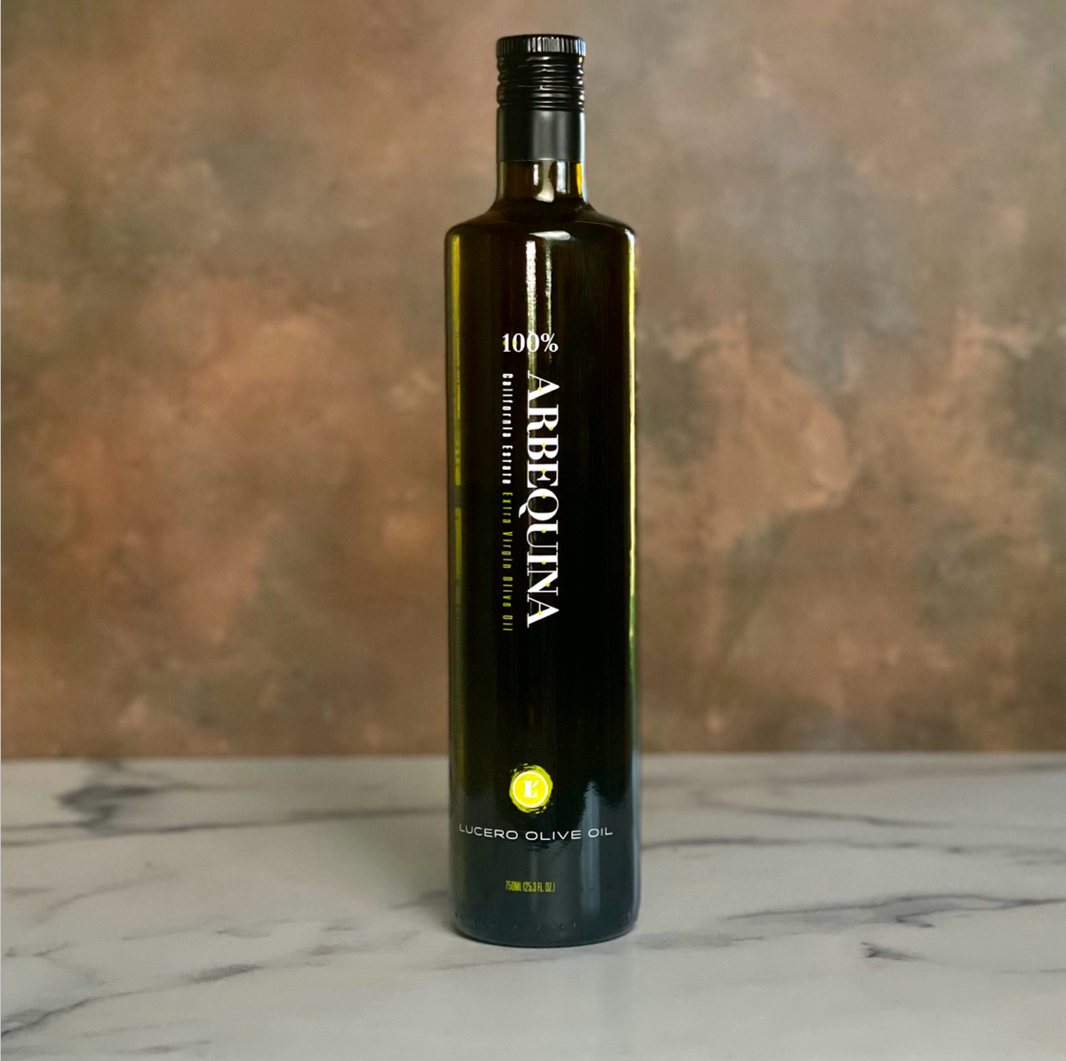 Single Bottle of Lucero Arbequina on a copper and marble counter top