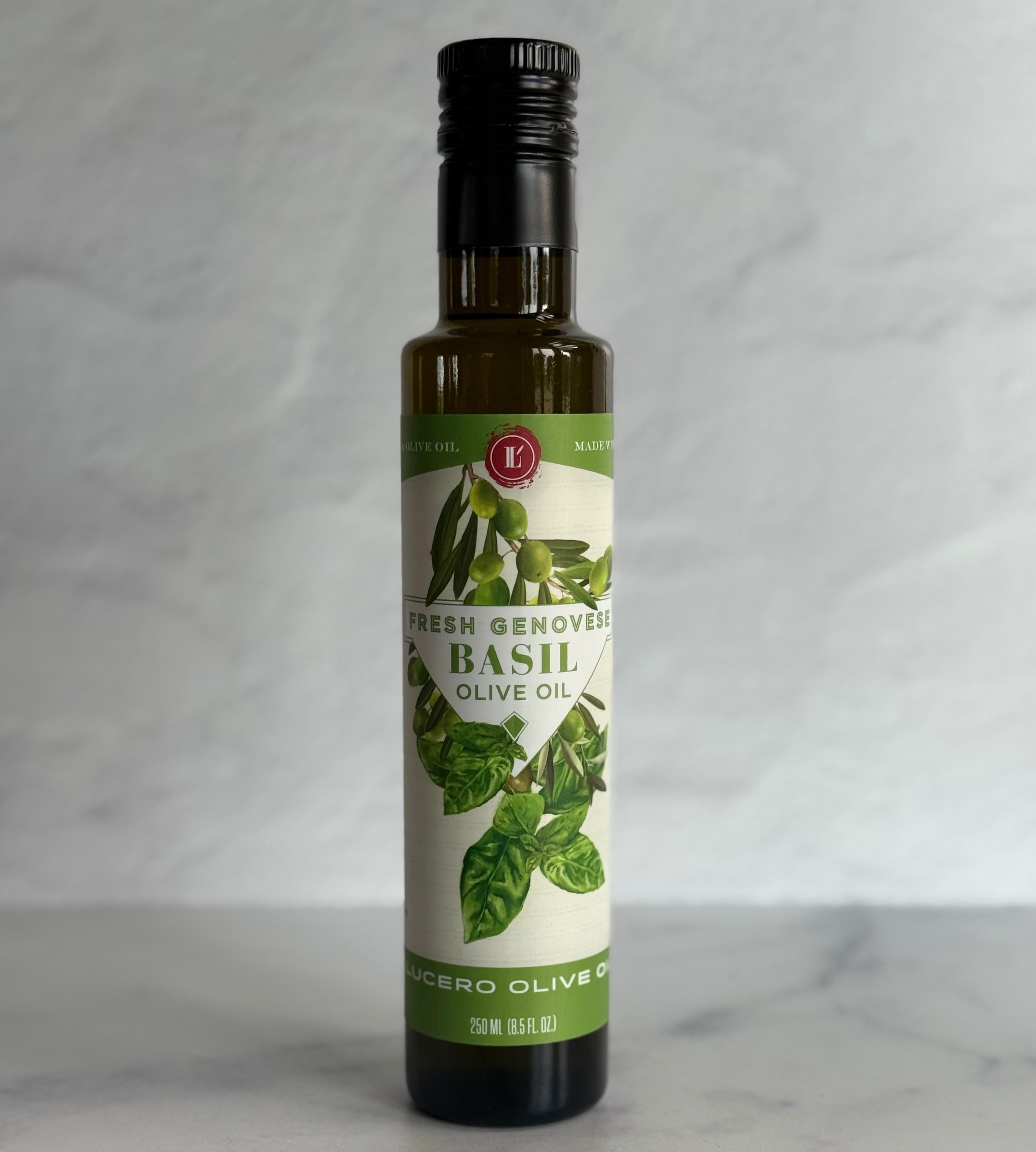 Bottle of basil olive oil with a green label on a gray background