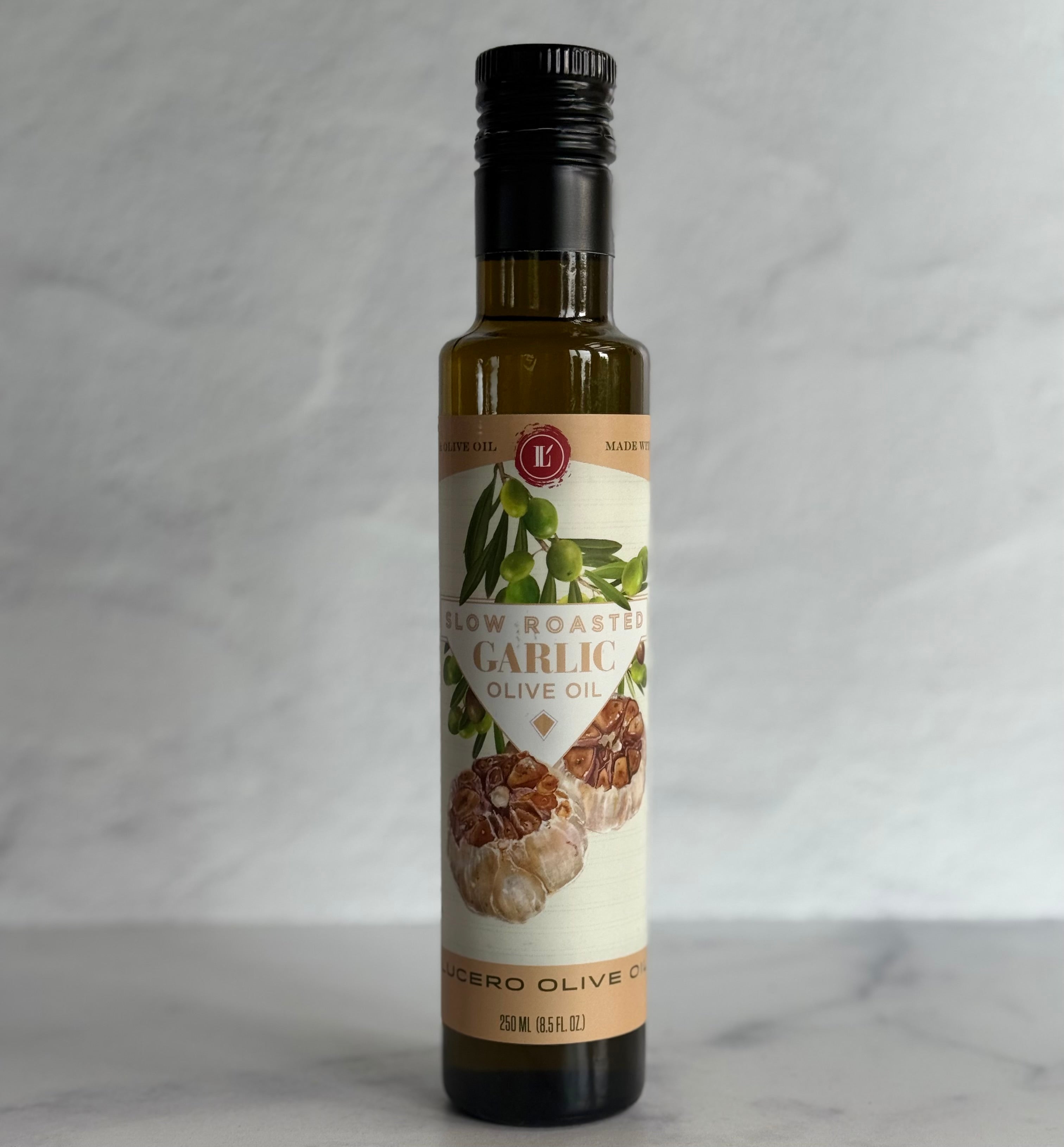 Bottle of Slow Roasted Garlic Olive Oil on a gray background