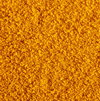 Super close image of the Turmeric Popcorn seasoning spread out so the seasoning itself can be perceived