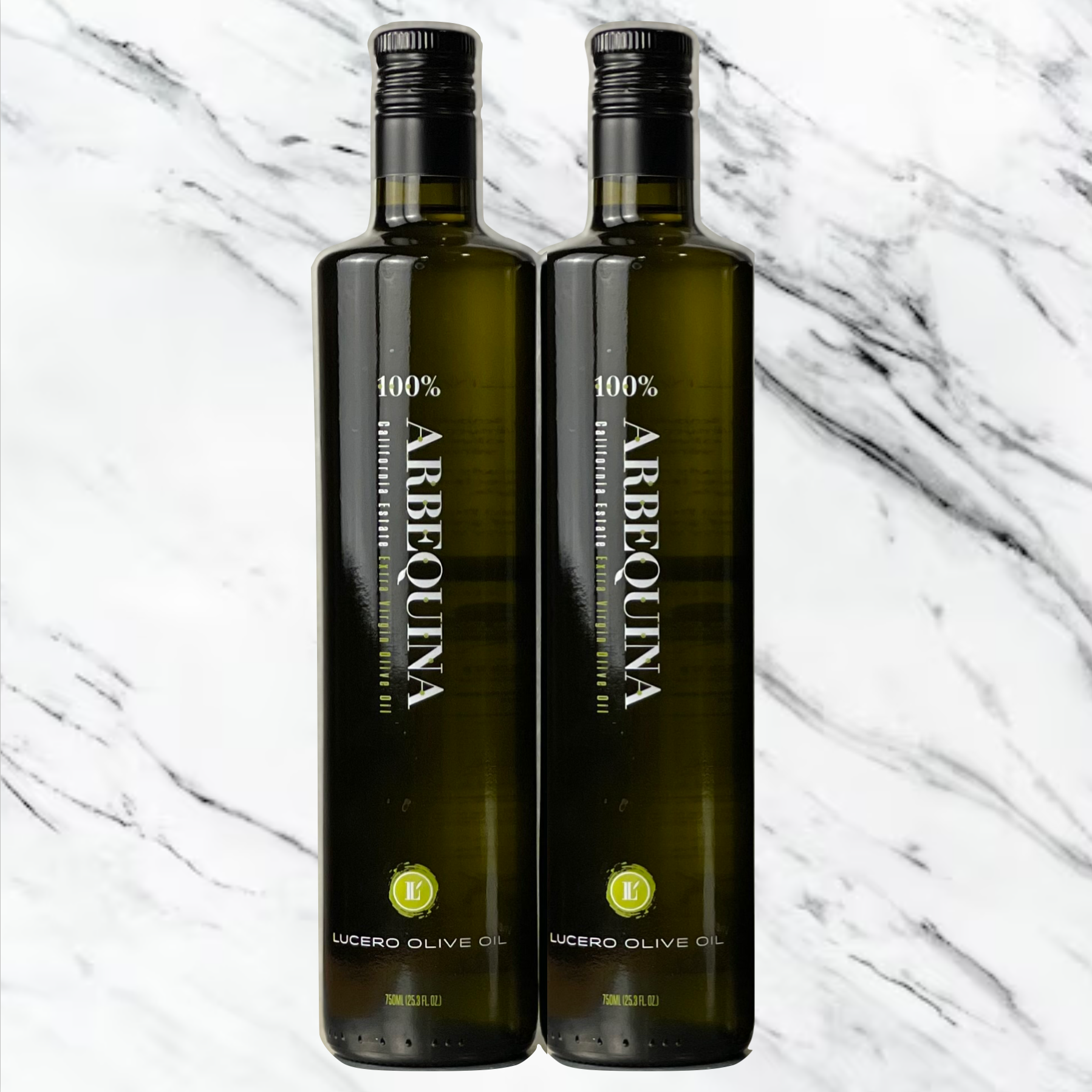 Two bottles of Lucero Arbequina EVOO in a large 750 ml bottle are shown side by side in front of a classic slab of marble