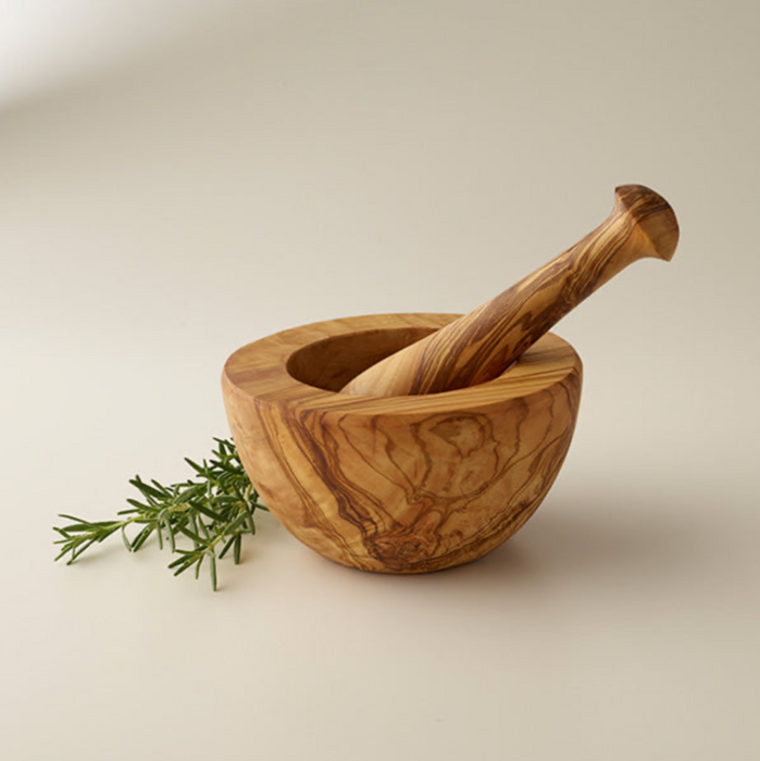 Modern olivewood mortar & pestle with smooth sides has notice that this is a CLEARANCE item