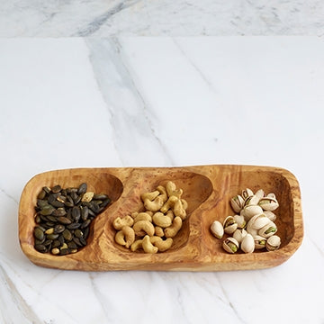 Olive wood Three Section Tray  is shown with roasted pumpkin seeds, cashews, and pistachios