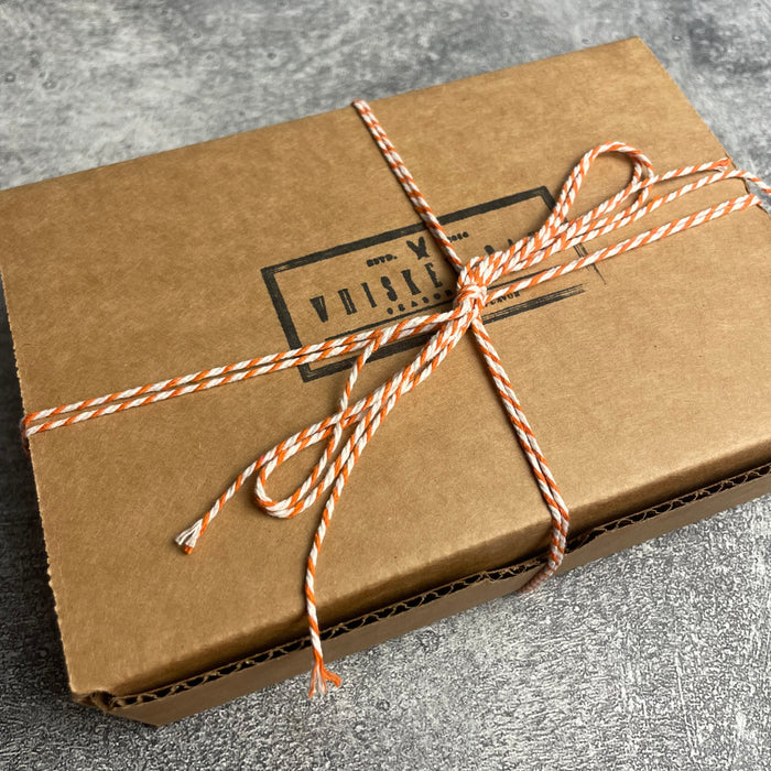Whiskey Oak Gift Box shown unopened and secured with decorative baker's twine.