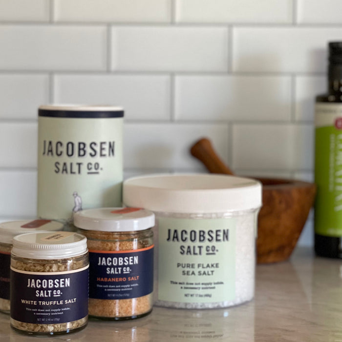 A grouping of assorted Jacobsen salts showing that the truffle salt is in a relatively small jar.