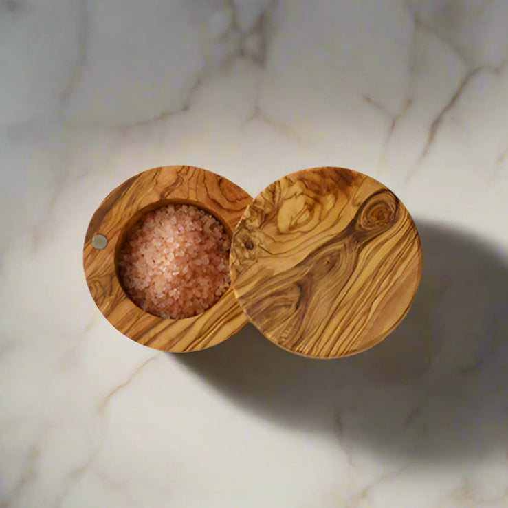 Olivewood salt box shown with hinged cover open.