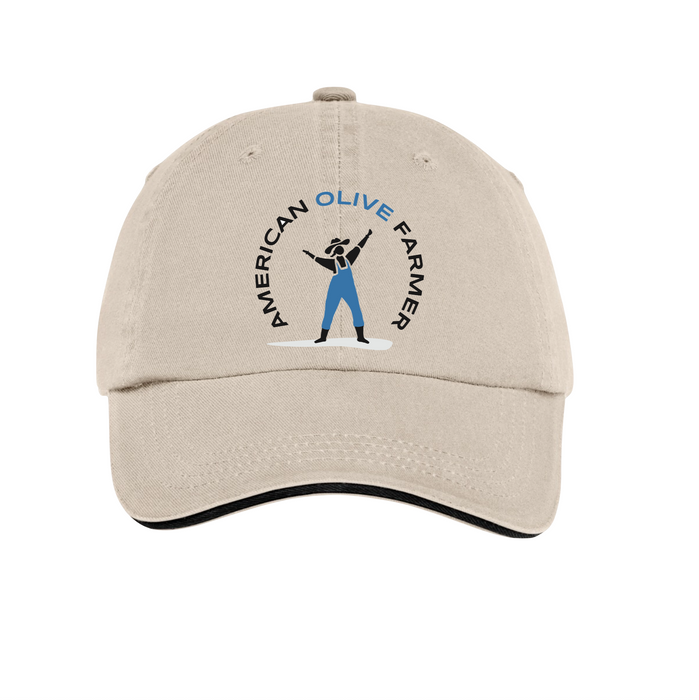 View of a light colored twill cap facing forward with a mock up of the American Olive Farmer logo, a woman in blue overalls reaching for the sky.