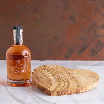 Heart Shaped Olivewood Board shown with Rosato Balsamic Vinegar